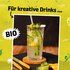 Illustration featuring a photo of a jar of SONNENTOR bergamot syrup, with the text: ‘For creative drinks’ on a yellow-green background on the label.